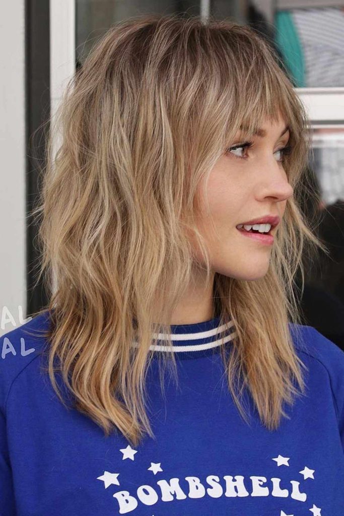 Blonde Layered Hair with Bangs